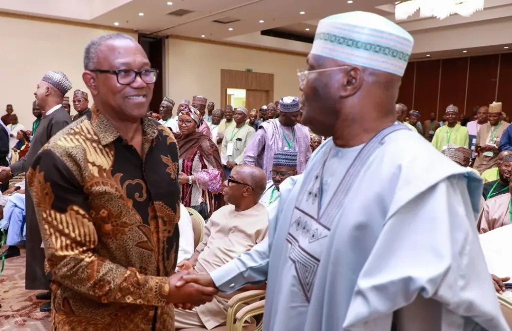 Atiku Abubakar in a handshake with Peter Obi - The Nation Digest News